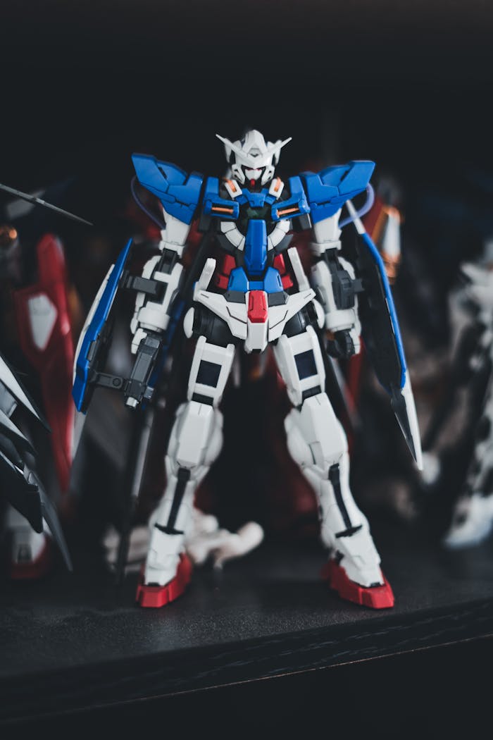 gallery-03 A detailed Gundam Exia plastic model figure with vibrant colors and intricate design.